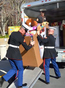 Marines loading toys for Toys for Tots toy drive.