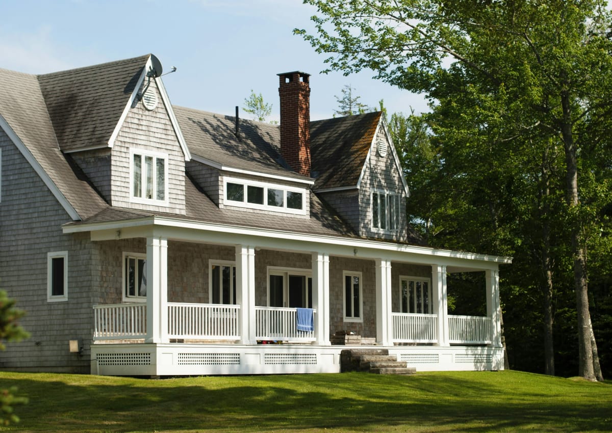 Front view of a residential home with front lawn