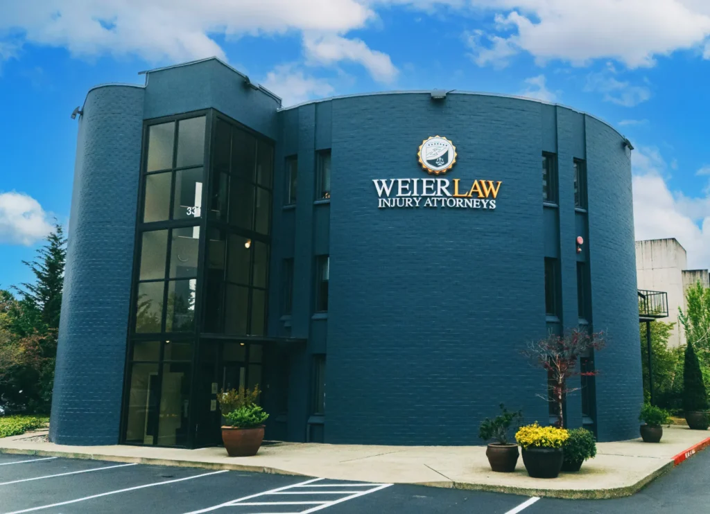 Exterior of WeierLaw office building with large logo sign